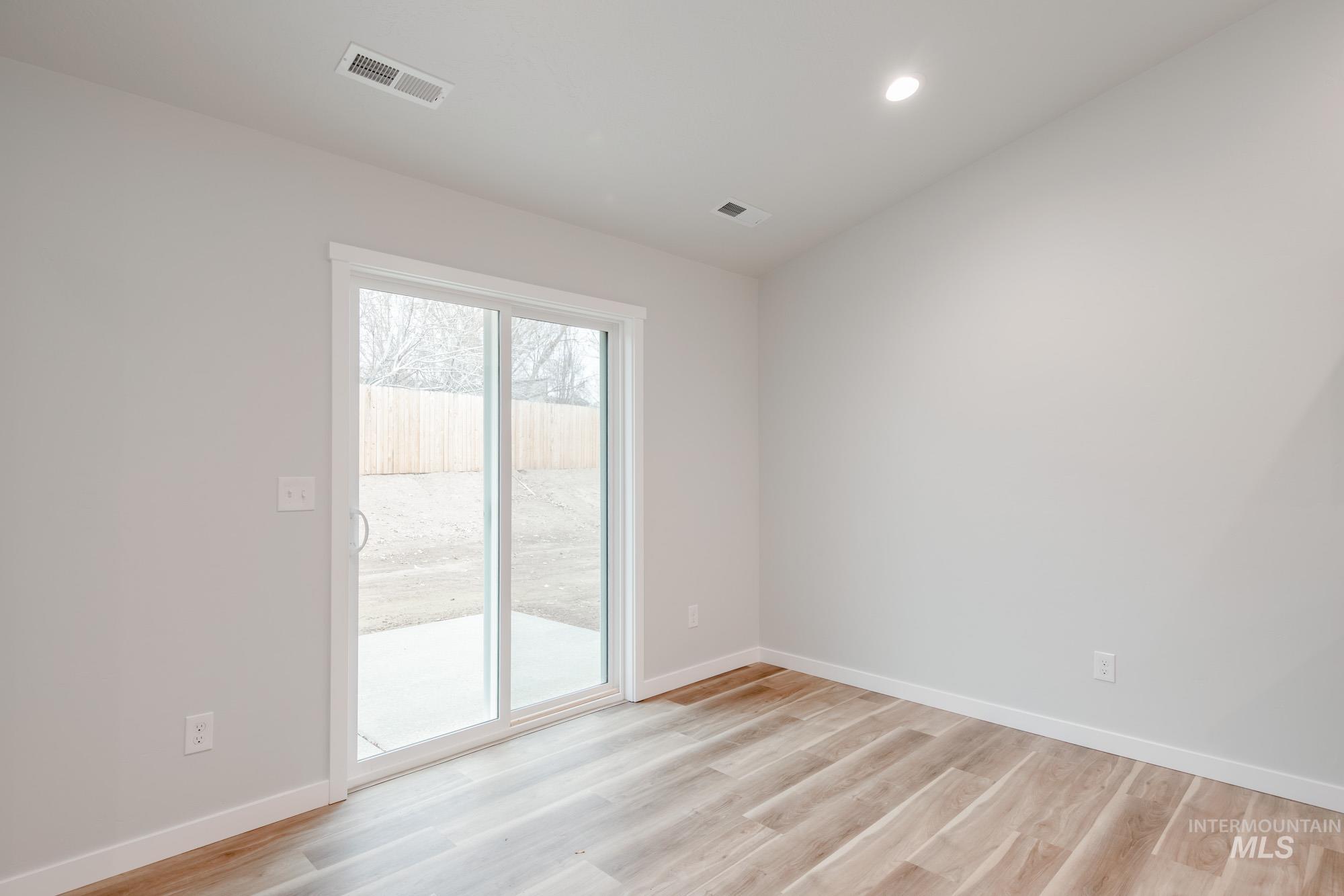 1576 Long Pond Street Middleton, ID 83644 - Photo 9 of 22 Spare room featuring light wood-style flooring and recessed lighting