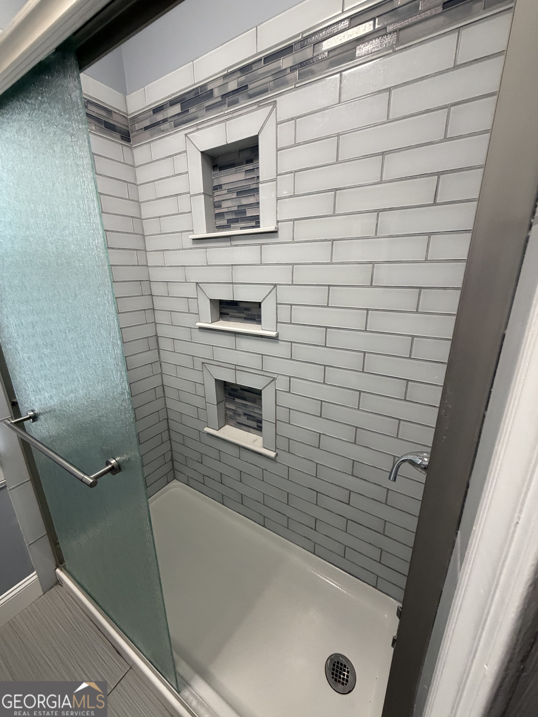 430 Bethany Road Covington, GA 30016 - Photo 17 of 39 a bathroom with a tub and a shower