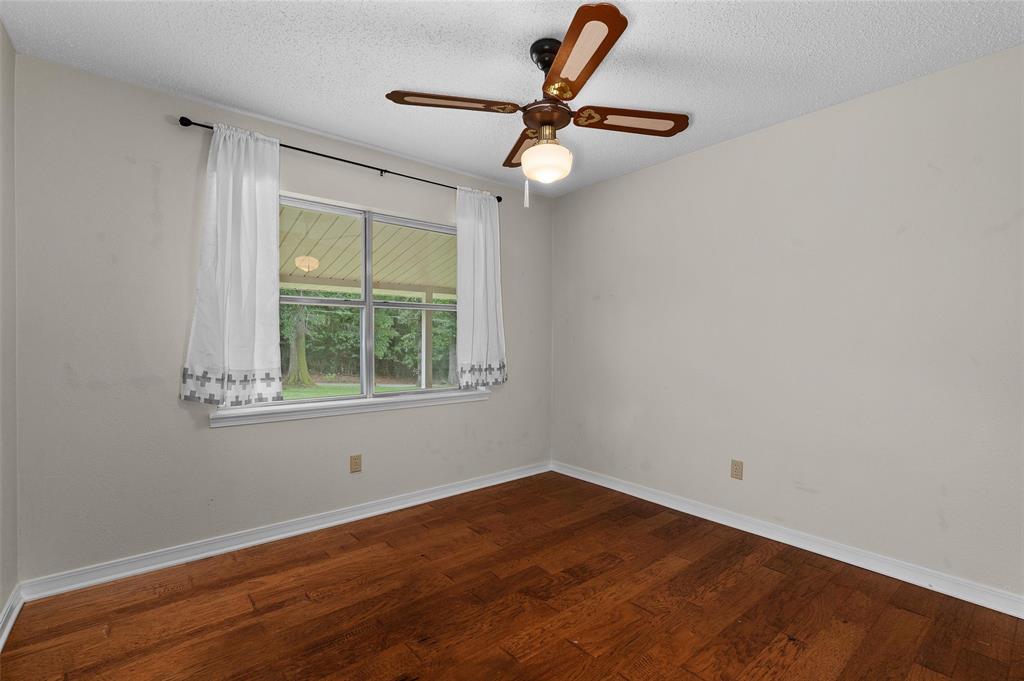 927 Stonewall-Preston Road Stonewall, LA 71078 - Photo 24 of 28 a view of a room with a window and a ceiling fan
