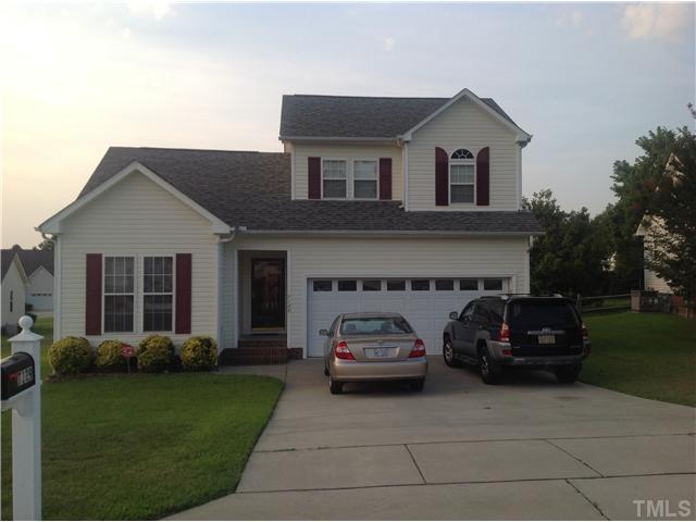 7129 Spanglers Spring Way Raleigh, NC 27610 - Photo 1 of 19 a car parked in front of a house