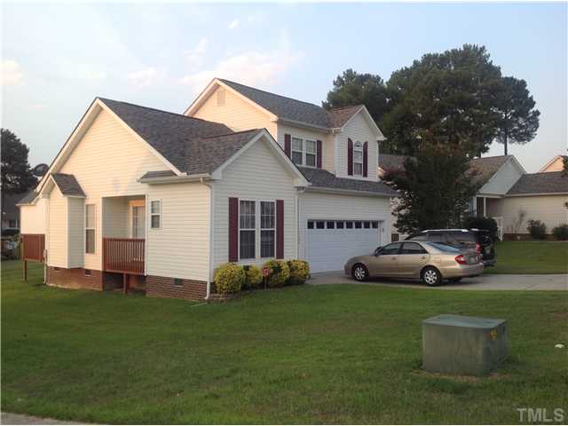 7129 Spanglers Spring Way Raleigh, NC 27610 - Photo 3 of 19 a front view of a house with garden