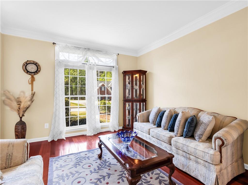 2354 Brentmoore Point Conyers, GA 30013 - Photo 12 of 91 a living room with furniture and floor to ceiling windows