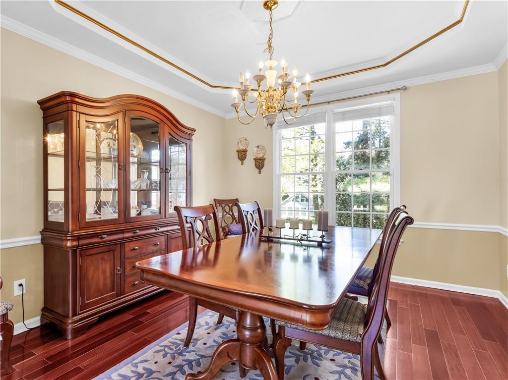 2354 Brentmoore Point Conyers, GA 30013 - Photo 13 of 91 a view of a dining room with furniture window and wooden floor