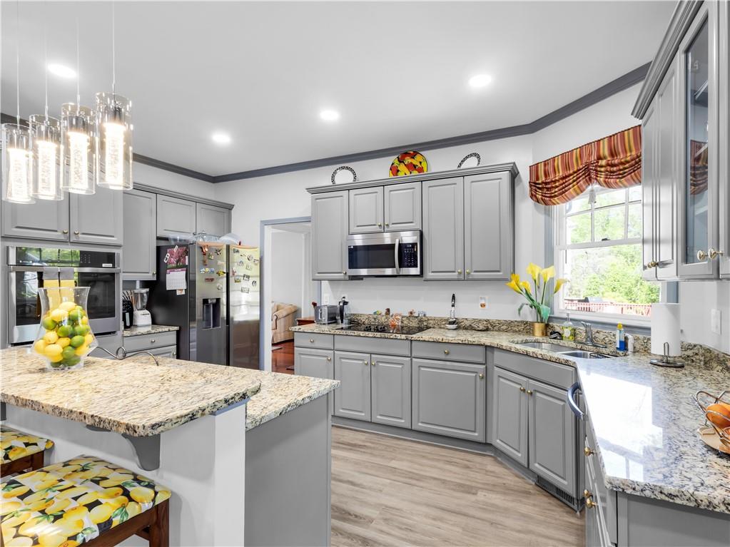 2354 Brentmoore Point Conyers, GA 30013 - Photo 22 of 91 a kitchen with stainless steel appliances granite countertop a sink and cabinets