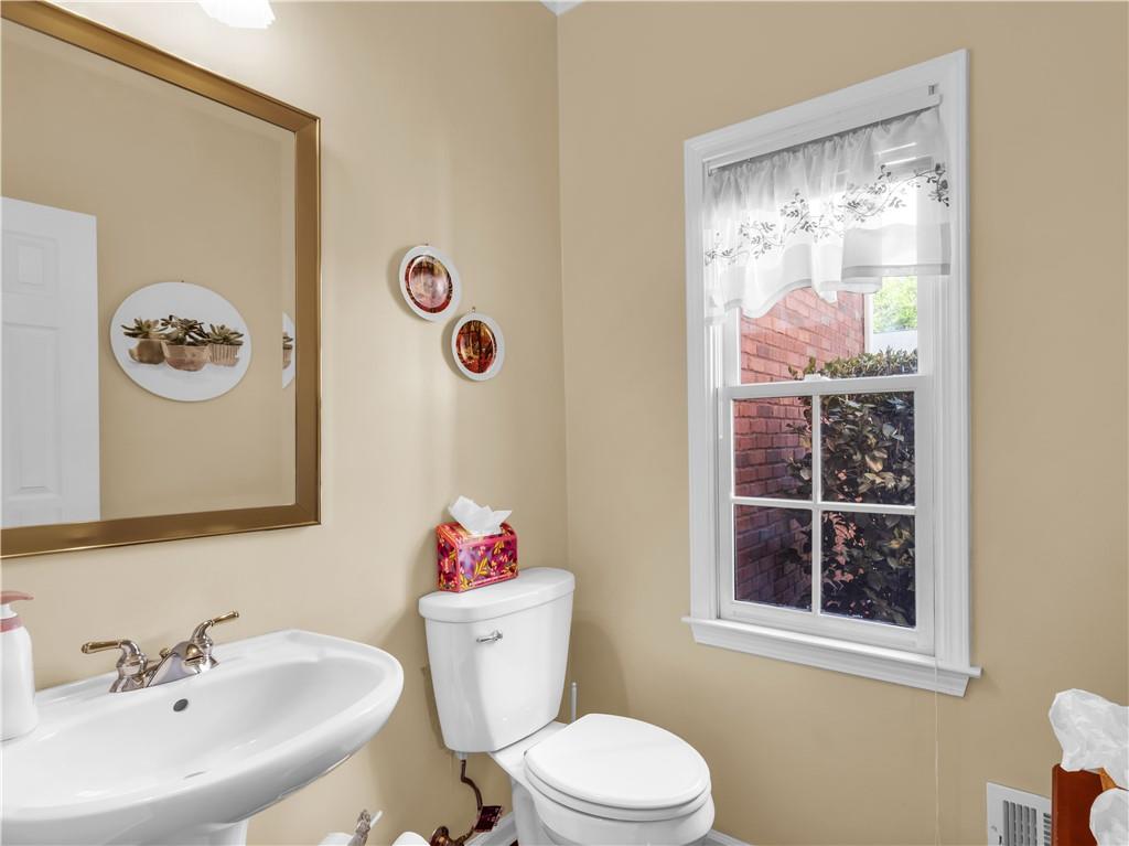 2354 Brentmoore Point Conyers, GA 30013 - Photo 32 of 91 a white toilet sitting next to a bathroom sink