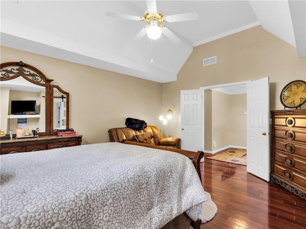 2354 Brentmoore Point Conyers, GA 30013 - Photo 37 of 91 a bedroom with a bed and a chandelier