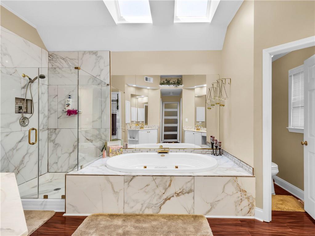 2354 Brentmoore Point Conyers, GA 30013 - Photo 39 of 91 a bathroom with a tub sink and mirror