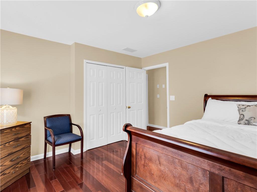 2354 Brentmoore Point Conyers, GA 30013 - Photo 54 of 91 a bedroom with a bed and a chair