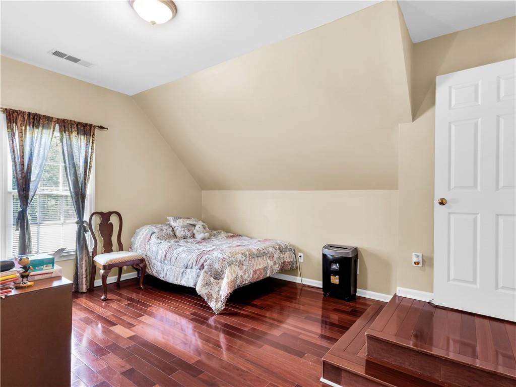 2354 Brentmoore Point Conyers, GA 30013 - Photo 58 of 91 a bedroom with a bed and a fireplace