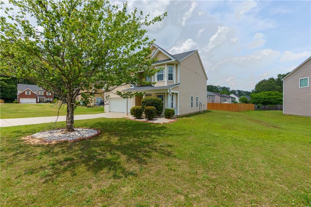 375 Walton View Fairburn, GA 30213 - Photo 28 of 38 a view of a house with backyard and trees