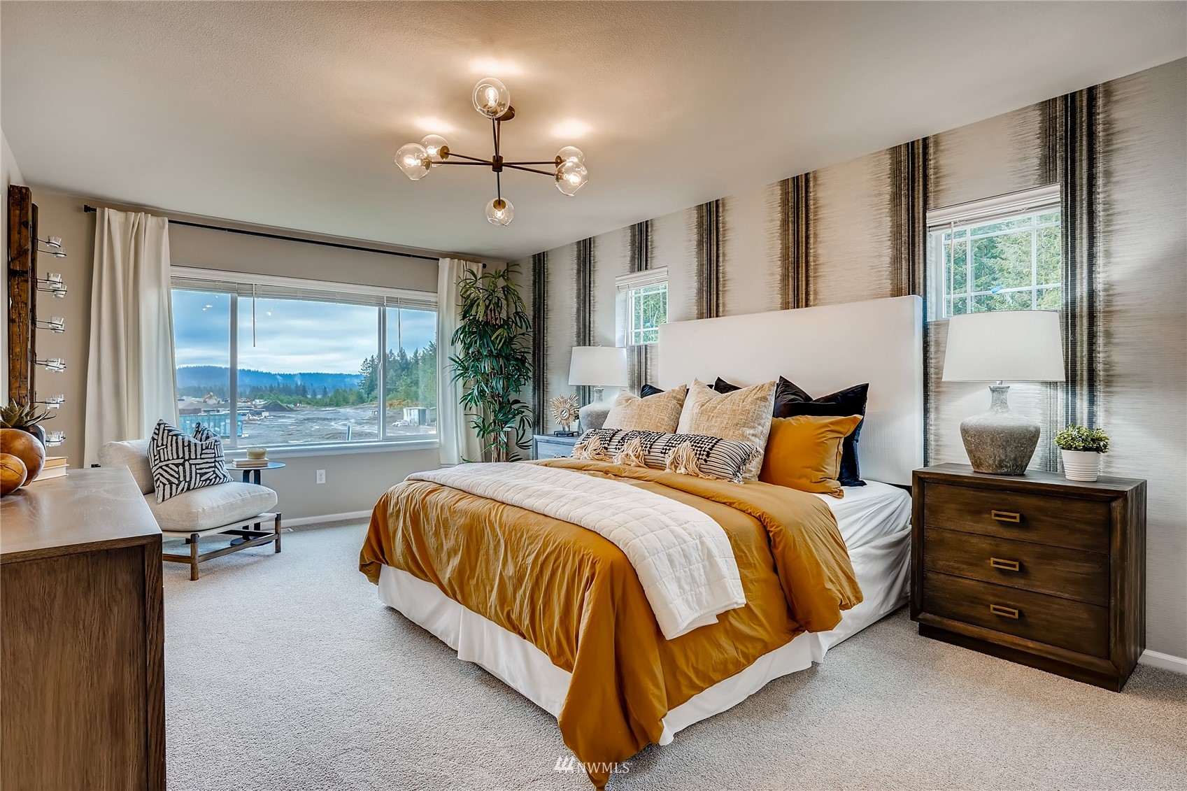 23518 41st Drive Southeast, Unit 53 Bothell, WA 98021 - Photo 20 of 24 a spacious bedroom with a bed and large windows