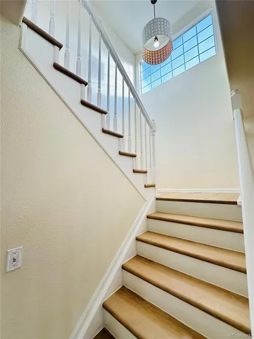 a view of a kitchen with a sink and cabinets