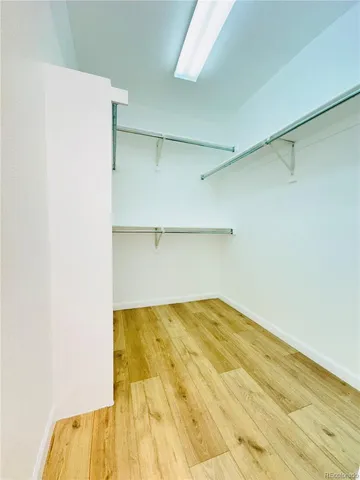 a large kitchen with a stove a sink dishwasher and a refrigerator