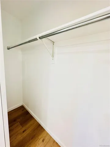 a bathroom with a granite countertop sink a toilet and a bathtub