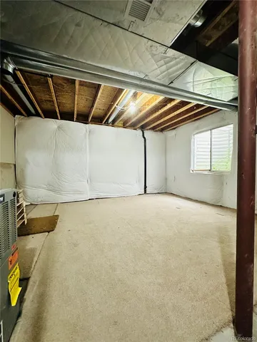 a view of a patio with a table chairs and a backyard