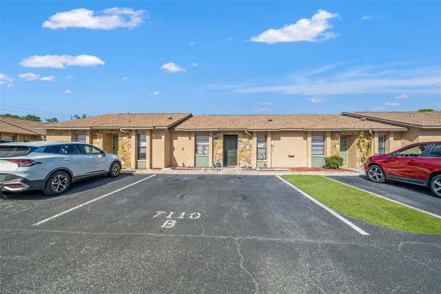 a view of a car parked in front of a house