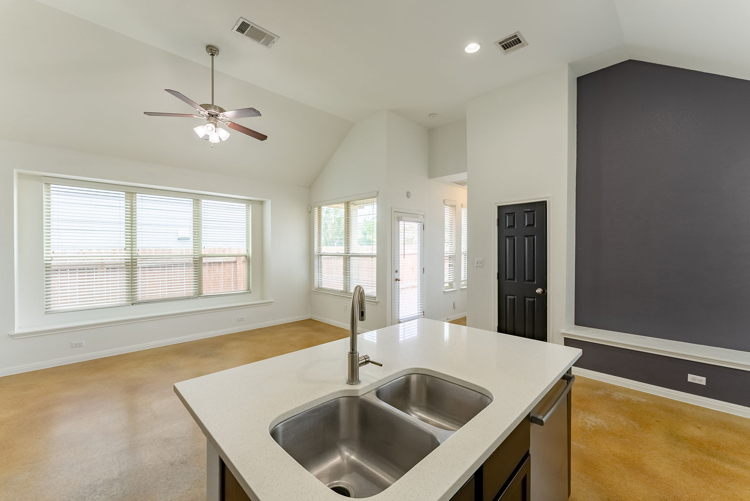 4514 Senda Lane Austin, TX 78725 - Photo 25 of 25 a view of a kitchen island a sink dishwasher a dining table and chairs