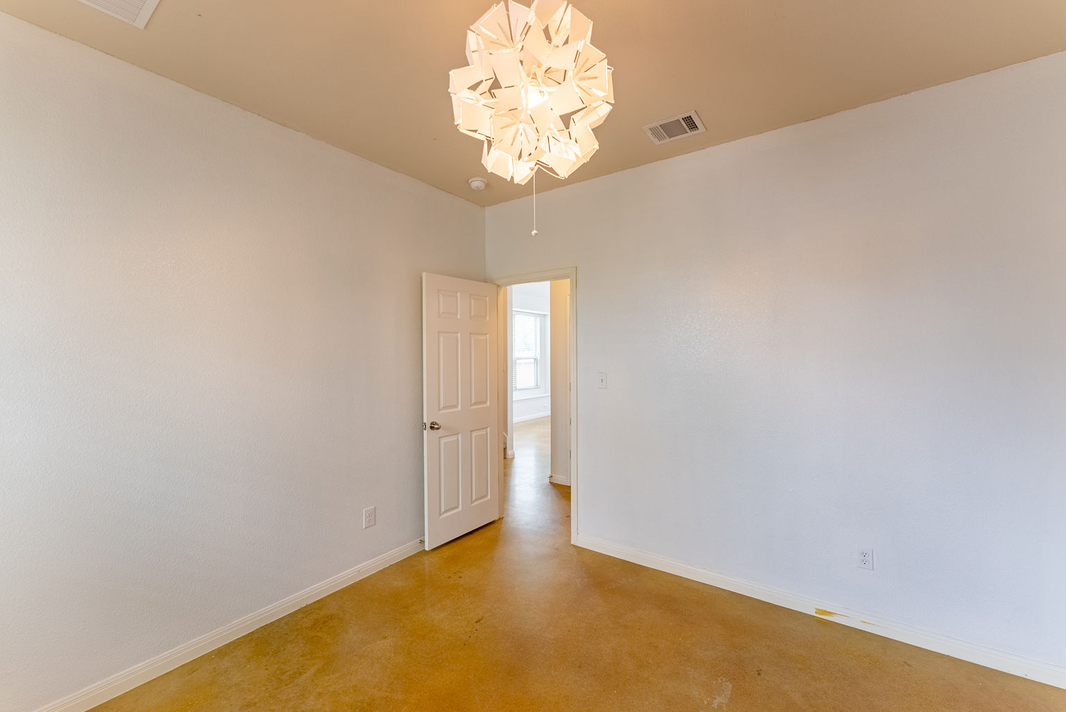 4514 Senda Lane Austin, TX 78725 - Photo 7 of 25 a view of an empty room with a chandelier fan