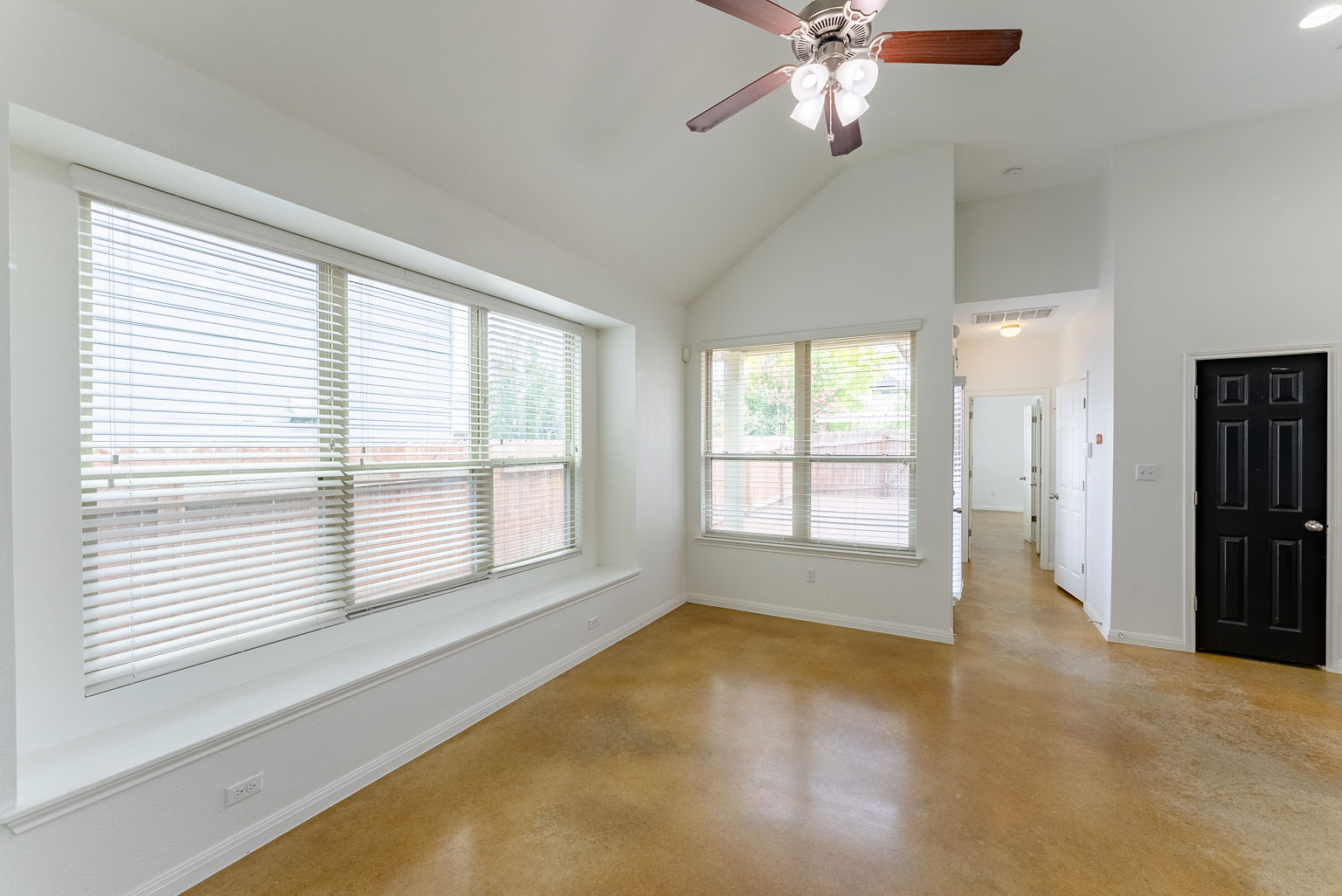 4514 Senda Lane Austin, TX 78725 - Photo 9 of 25 a view of an empty room with a window
