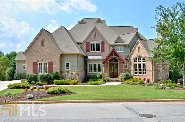 Stunning stone and brick home on gorgeous, level golf lot.