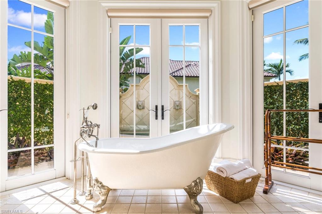 3275 Green Dolphin Lane Naples, FL 34102 - Photo 14 of 35 a living room with a window and chairs