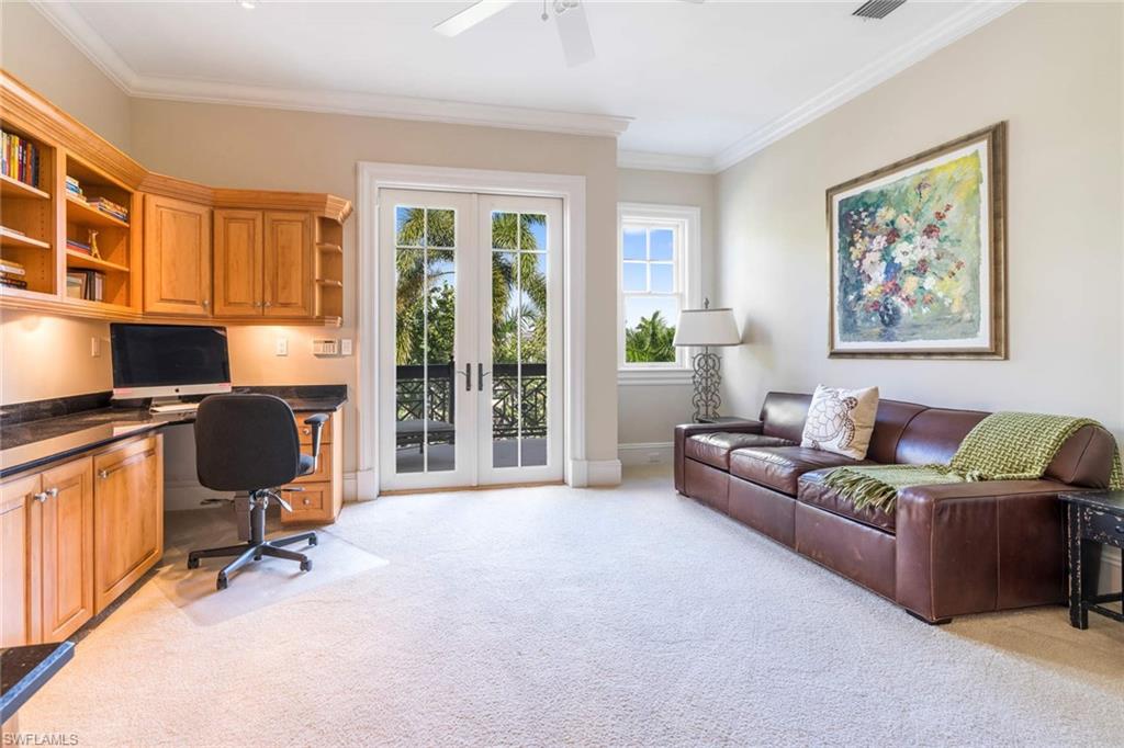 3275 Green Dolphin Lane Naples, FL 34102 - Photo 18 of 35 a living room with furniture ceiling fan and a window