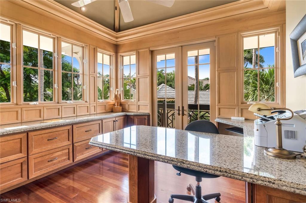 3275 Green Dolphin Lane Naples, FL 34102 - Photo 19 of 35 a kitchen with stainless steel appliances granite countertop a sink and a counter space