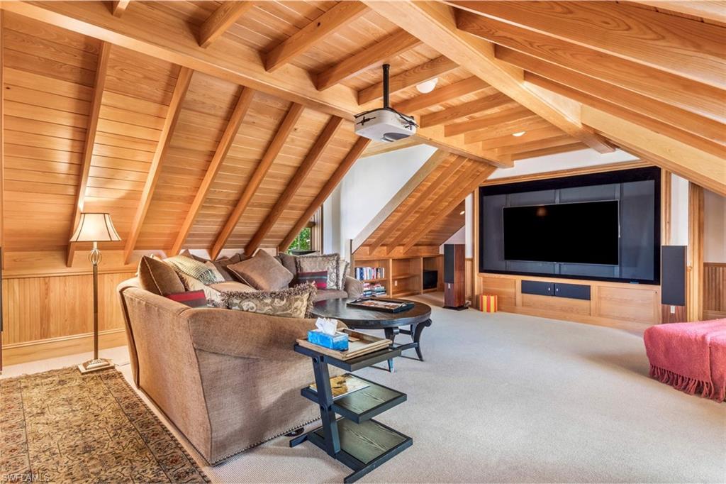 3275 Green Dolphin Lane Naples, FL 34102 - Photo 20 of 35 a living room with furniture and a flat screen tv