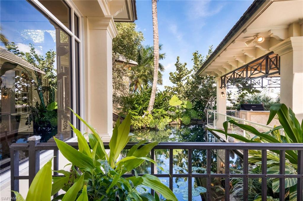 3275 Green Dolphin Lane Naples, FL 34102 - Photo 21 of 35 a view of a balcony with plants