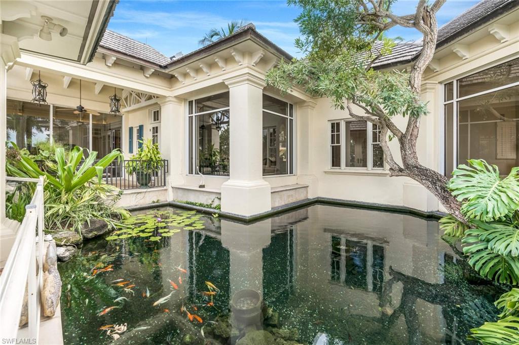 3275 Green Dolphin Lane Naples, FL 34102 - Photo 22 of 35 front view of a house with a yard