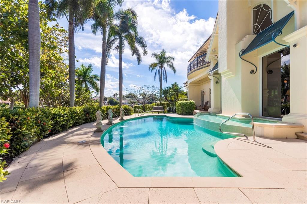 3275 Green Dolphin Lane Naples, FL 34102 - Photo 24 of 35 a view of a swimming pool with a patio