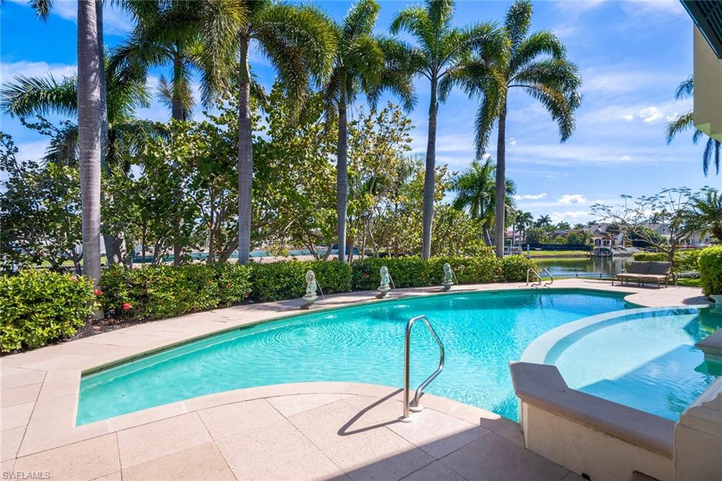 3275 Green Dolphin Lane Naples, FL 34102 - Photo 26 of 35 a view of a swimming pool with a patio