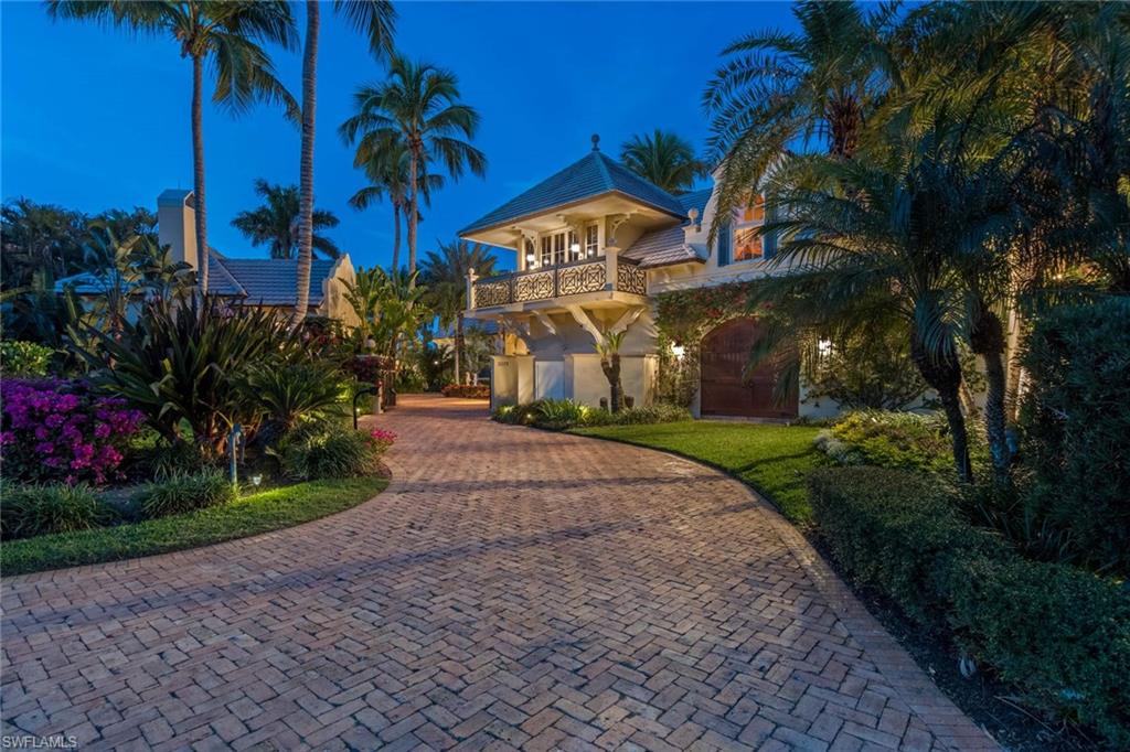 3275 Green Dolphin Lane Naples, FL 34102 - Photo 31 of 35 a view of a street with a building in the background
