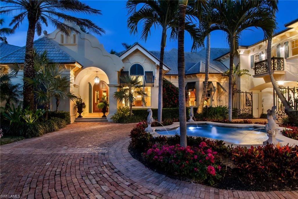 3275 Green Dolphin Lane Naples, FL 34102 - Photo 32 of 35 a view of a house with fountain and entertaining space