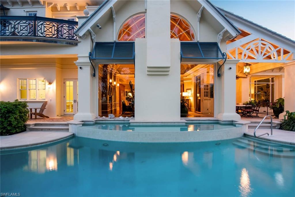 3275 Green Dolphin Lane Naples, FL 34102 - Photo 33 of 35 swimming pool view with a outdoor seating space