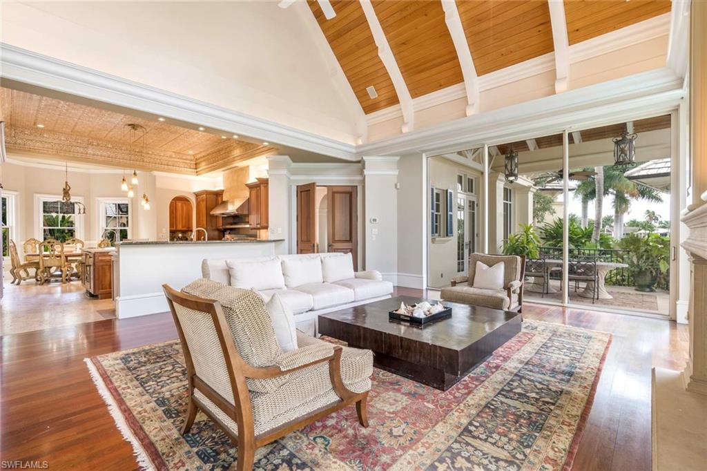 3275 Green Dolphin Lane Naples, FL 34102 - Photo 8 of 35 a living room with furniture and a large window