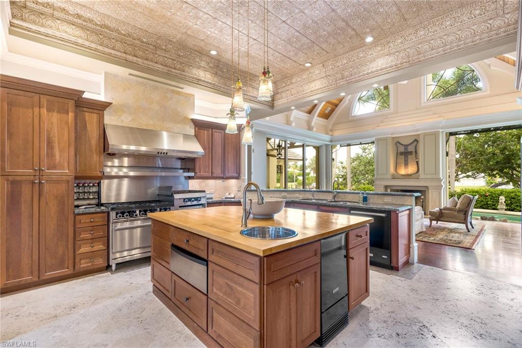 3275 Green Dolphin Lane Naples, FL 34102 - Photo 10 of 35 a kitchen with counter top space and stainless steel appliances