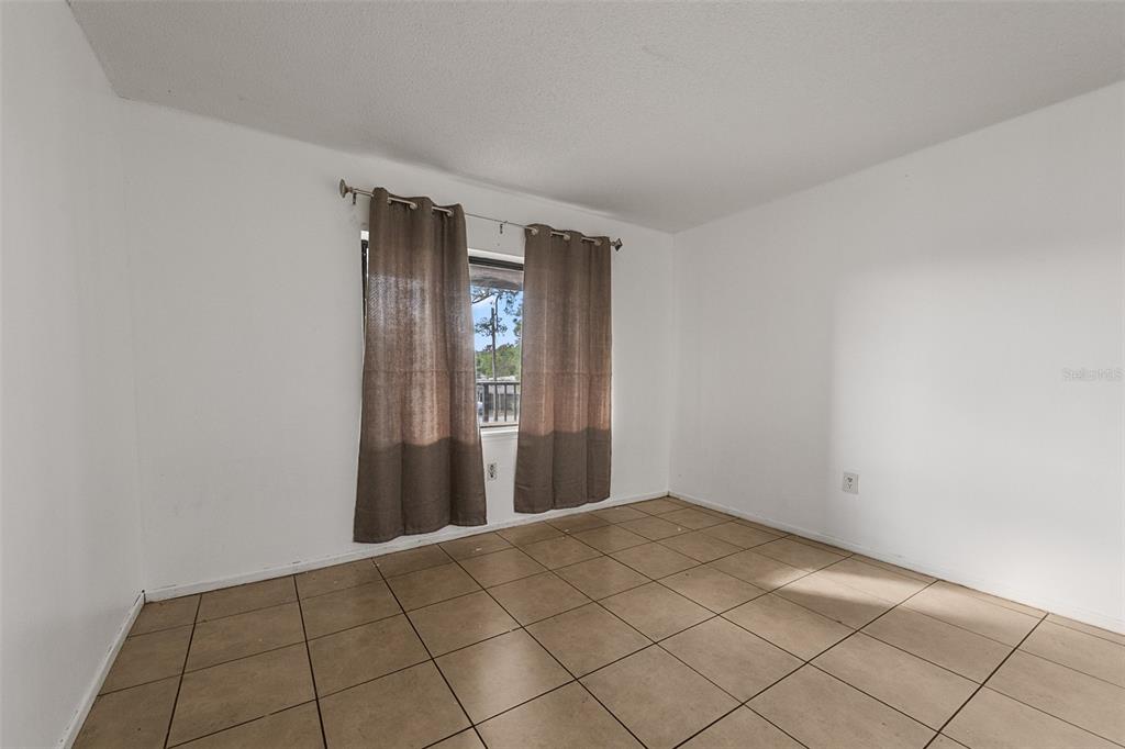 2547 Myrtle Avenue Sanford, FL 32773 - Photo 12 of 13 a view of an empty room and window