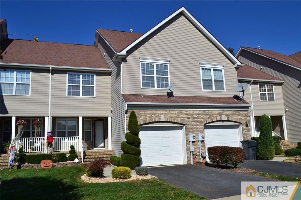 19 Dickerson Lane, Unit X Old Bridge, NJ 08857 - Photo 1 of 25 a front view of a house with a yard