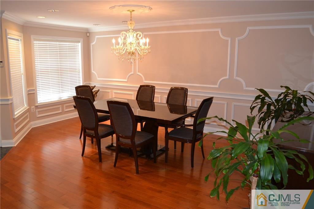 19 Dickerson Lane, Unit X Old Bridge, NJ 08857 - Photo 2 of 25 a view of a dining room with furniture window and wooden floor
