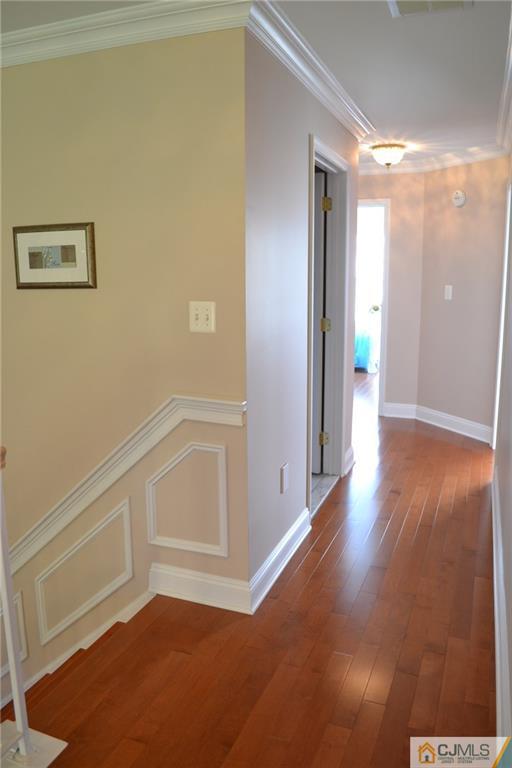 19 Dickerson Lane, Unit X Old Bridge, NJ 08857 - Photo 12 of 25 a view of an empty room with wooden floor and a window
