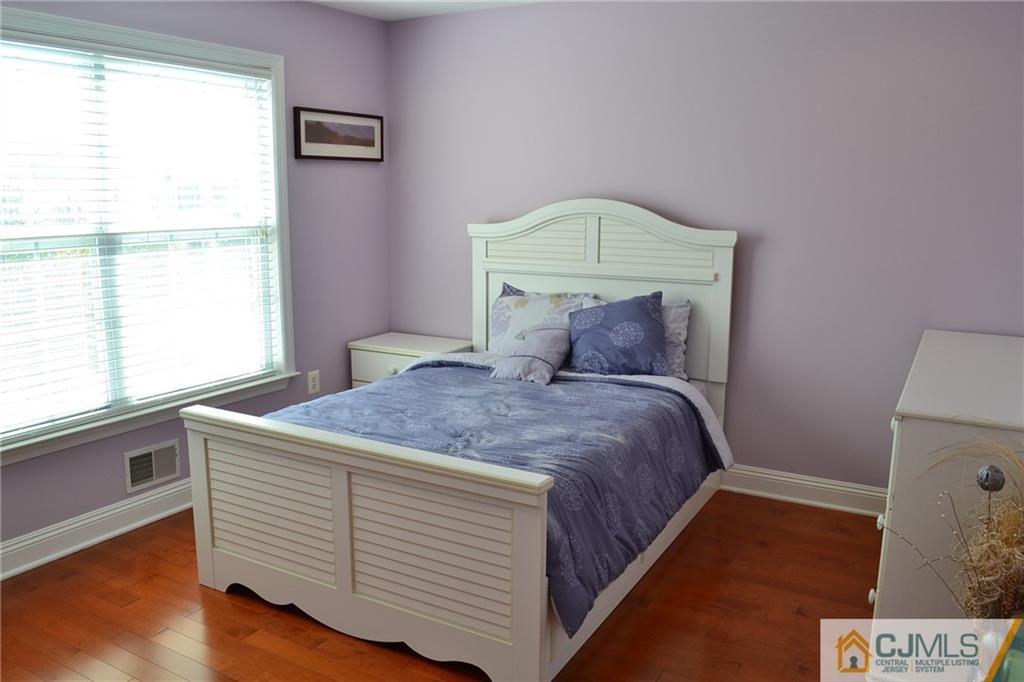 19 Dickerson Lane, Unit X Old Bridge, NJ 08857 - Photo 15 of 25 a bedroom with a bed and a window