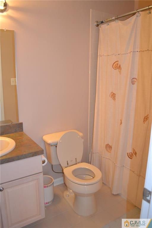 19 Dickerson Lane, Unit X Old Bridge, NJ 08857 - Photo 17 of 25 a white toilet sitting next to a bathroom sink
