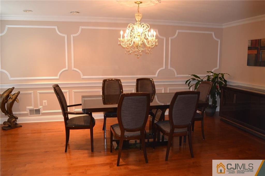 19 Dickerson Lane, Unit X Old Bridge, NJ 08857 - Photo 3 of 25 a view of a dining room with furniture window and wooden floor