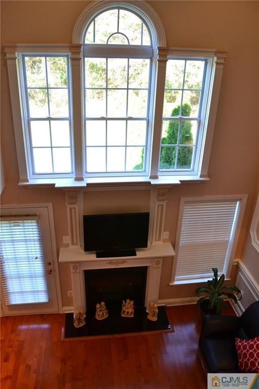 19 Dickerson Lane, Unit X Old Bridge, NJ 08857 - Photo 5 of 25 a living room with furniture and a fireplace