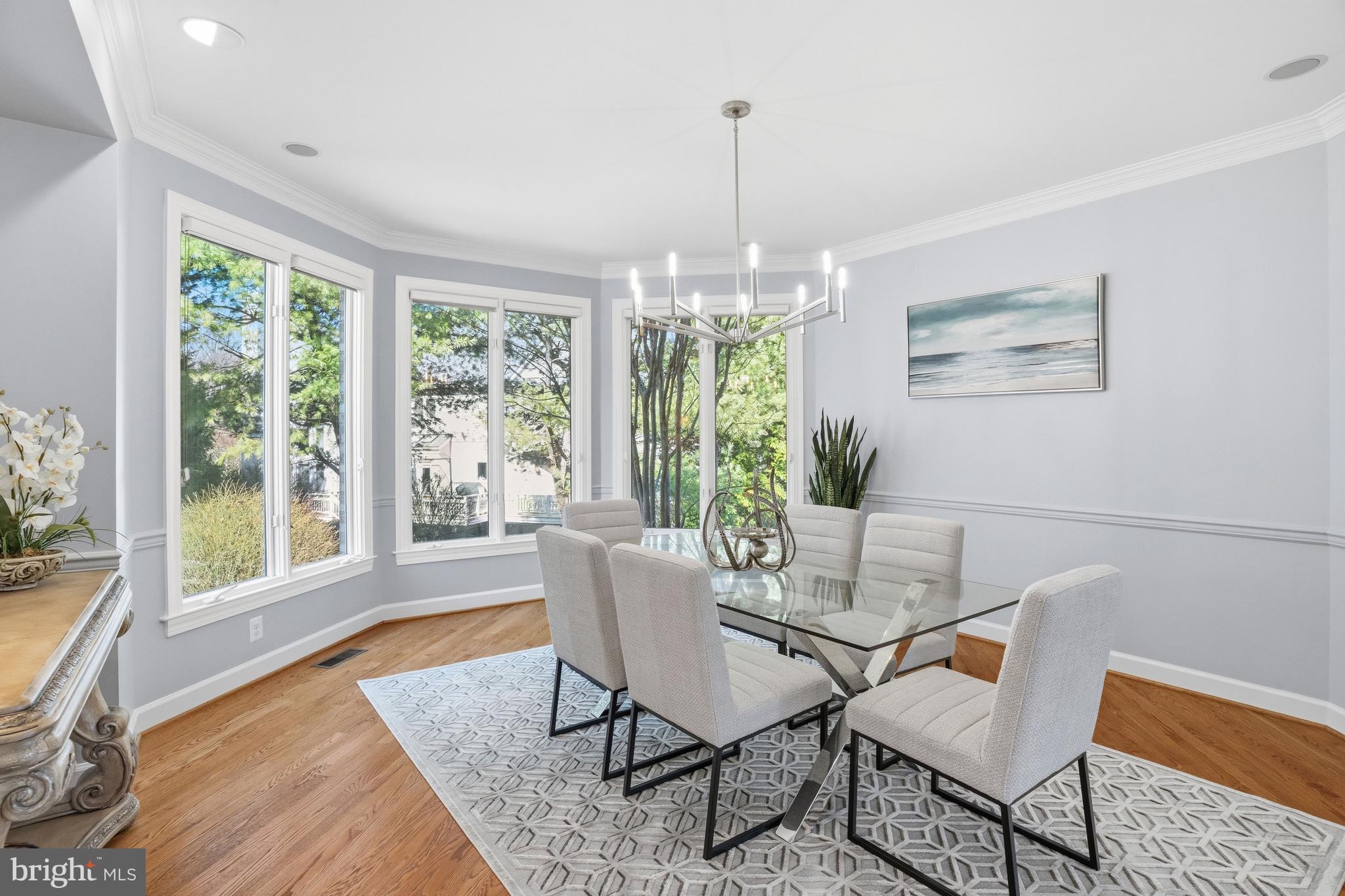 1156 Fieldview Drive Reston, VA 20194 - Photo 19 of 104 a dining room with furniture a chandelier and wooden floor
