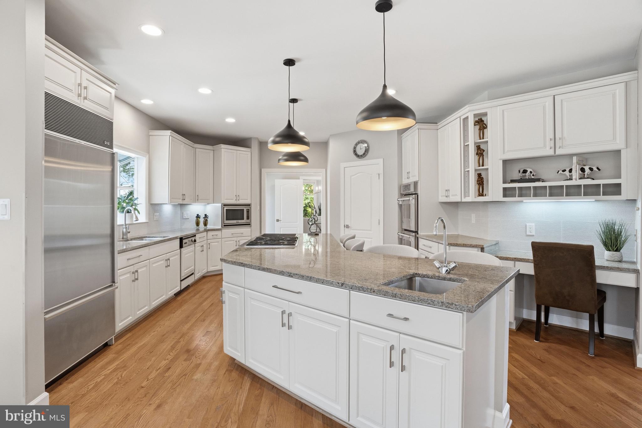 1156 Fieldview Drive Reston, VA 20194 - Photo 28 of 104 a kitchen with stainless steel appliances granite countertop a sink a stove a refrigerator and island with wooden floor