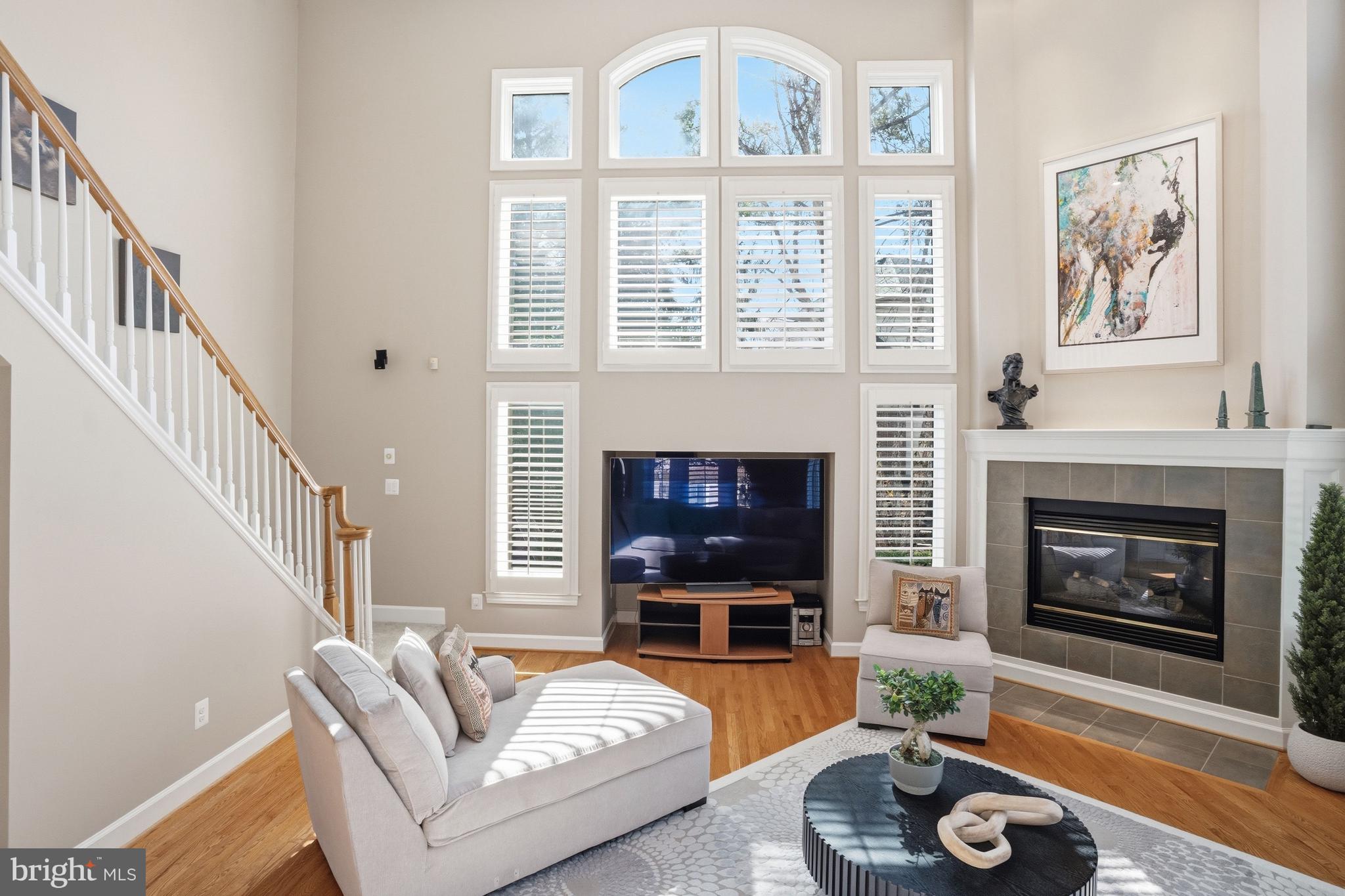 1156 Fieldview Drive Reston, VA 20194 - Photo 36 of 104 a living room with furniture a fireplace and a floor to ceiling window