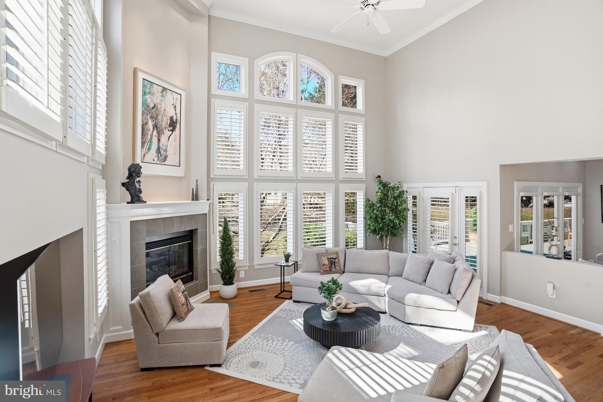 1156 Fieldview Drive Reston, VA 20194 - Photo 38 of 104 a living room with furniture a fireplace and a large window