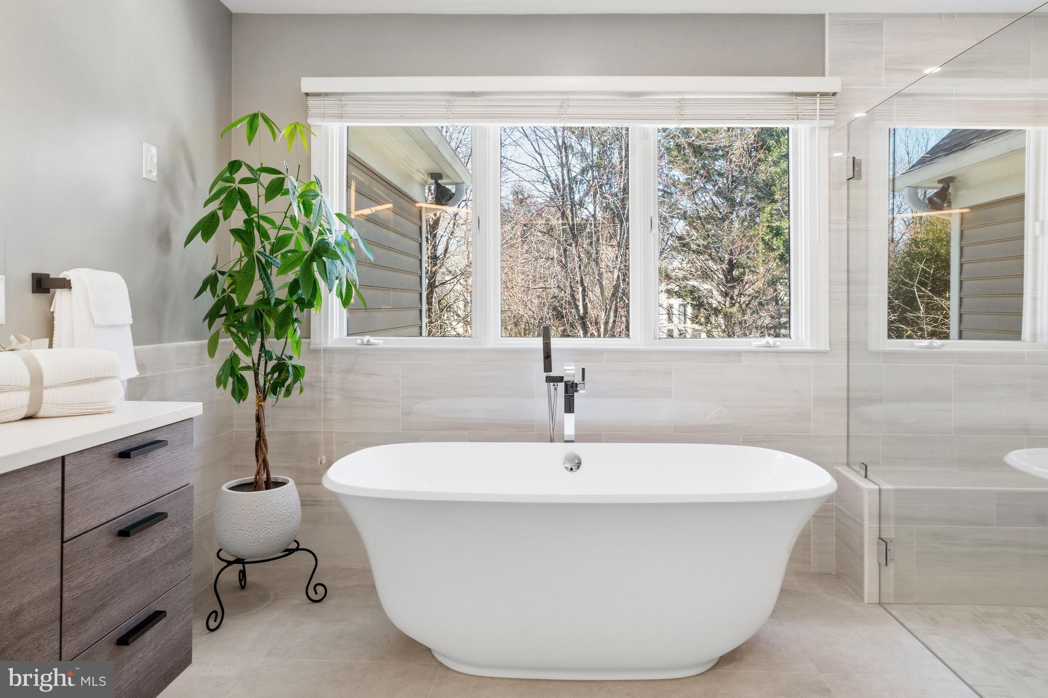 1156 Fieldview Drive Reston, VA 20194 - Photo 60 of 104 a white bath tub sitting in a bathroom next to a window